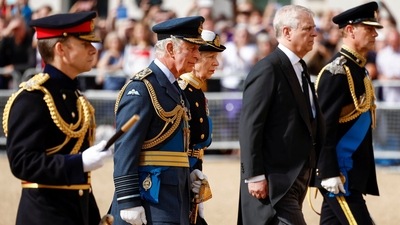 Britain's Prince William, Prince of Wales, Sir Timothy Laurence, Prince Harry, Duke of Sussex, King Charles III, Mr Peter Phillips, Anne, Princess Royal and Prince Andrew, Duke of York walk behind the coffin during the procession for the Lying-in State of Queen Elizabeth II. (REUTERS)