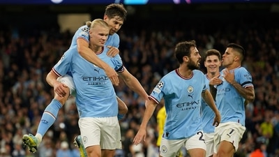 Manchester City's Erling Haaland, left, celebrates after scoring his side's 2nd goal during the group G Champions League soccer match between Manchester City and Borussia Dortmund at the Etihad stadium in Manchester (AP) Manchester City's Erling Haaland, left, celebrates after scoring his side's 2nd goal during the group G Champions League soccer match between Manchester City and Borussia Dortmund at the Etihad stadium in Manchester (AP)