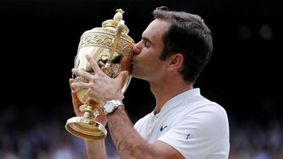 Switzerland’s Roger Federer celebrates with the trophy after winning the final against Croatia’s Marin Cilic&nbsp; (REUTERS)