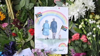  A drawing of Britain's Queen Elizabeth II and Britain's Prince Philip, Duke of Edinburgh, is seen amongst flowers at a floral tribute outside Windsor Castle following the death of Queen Elizabeth II. (AFP) A drawing of Britain's Queen Elizabeth II and Britain's Prince Philip, Duke of Edinburgh, is seen amongst flowers at a floral tribute outside Windsor Castle following the death of Queen Elizabeth II. (AFP)