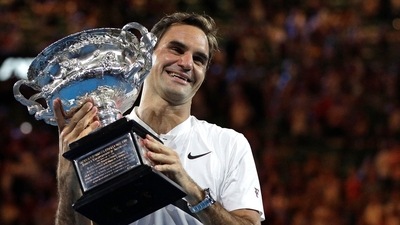 Roger Federer holds his trophy after defeating Marin Cilic during the men's singles final at the Australian Open&nbsp; (AP)