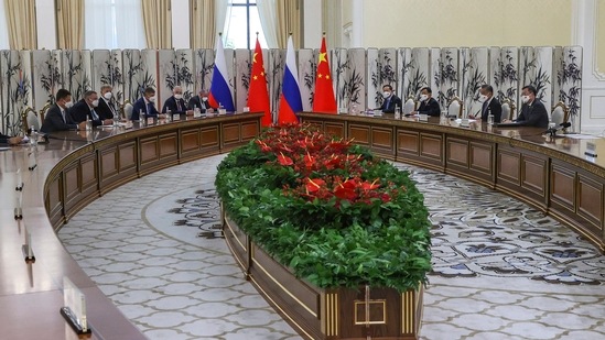 Shanghai Cooperation Organisation: Russian President Vladimir Putin and Chinese President Xi Jinping talk during their meeting on the sidelines of the Shanghai Cooperation Organisation.(AP)