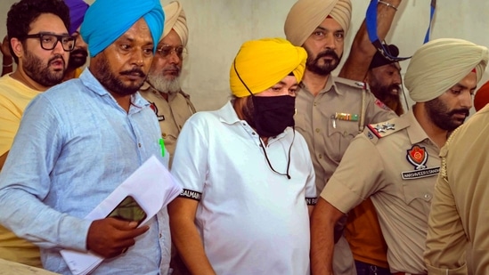 File pic of Daler Mehndi being taken to jail after sentencing for his involvement in a human trafficking case, at District Court complex in Patiala, Thursday, July 14, 2022. (PTI Photo)(PTI)