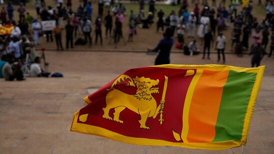 Sri Lanka Crisis: A Sri Lankan flag is waved by a protester in Colombo, Sri Lanka.(AP File)