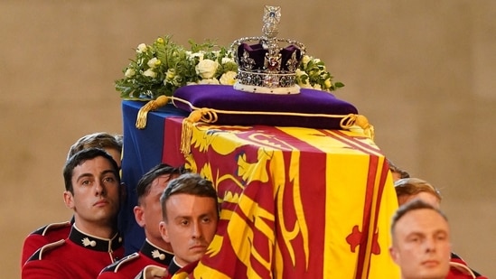 Queen Elizabeth II's Funeral: Guards carry the coffin of Queen Elizabeth II into Westminster Hall.(AFP)