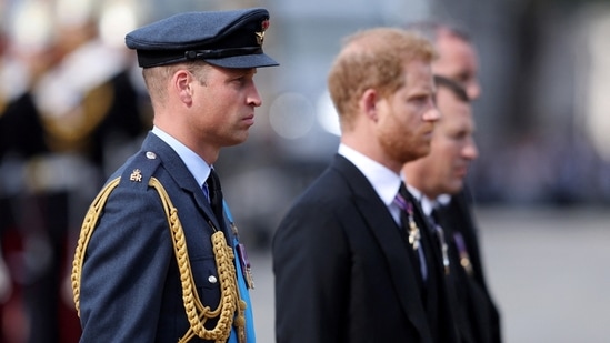 William, Prince of Wales and Prince Harry, Duke of Sussex walk behind the coffin during the procession for the Lying-in State of Queen Elizabeth II on September 14, 2022 in London, England. (Richard Heathcote/Pool via REUTERS)