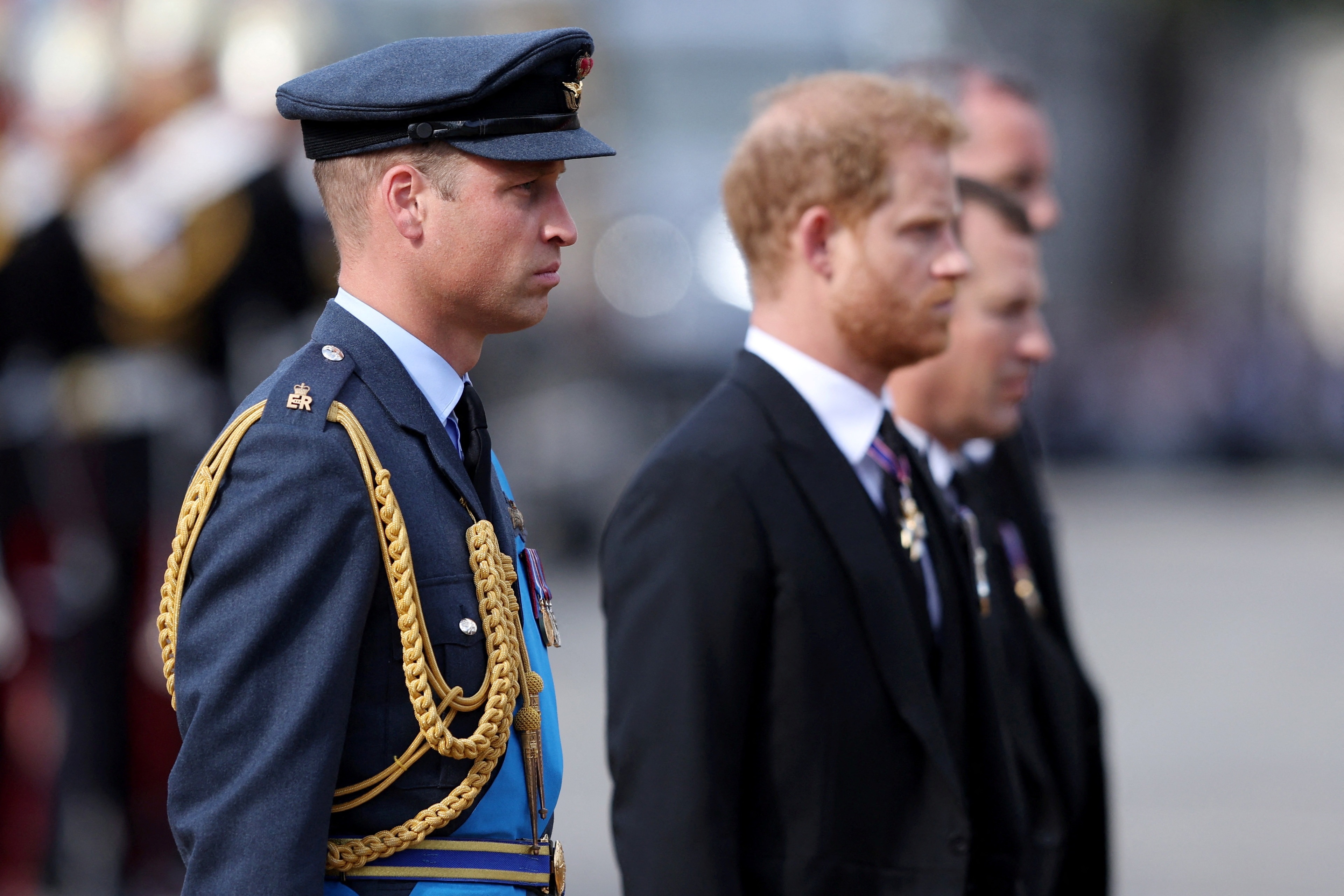 William, Prince of Wales and Prince Harry, Duke of Sussex walk behind the coffin during the procession for the Lying-in State of Queen Elizabeth II on September 14, 2022 in London, England. (Richard Heathcote/Pool via REUTERS)