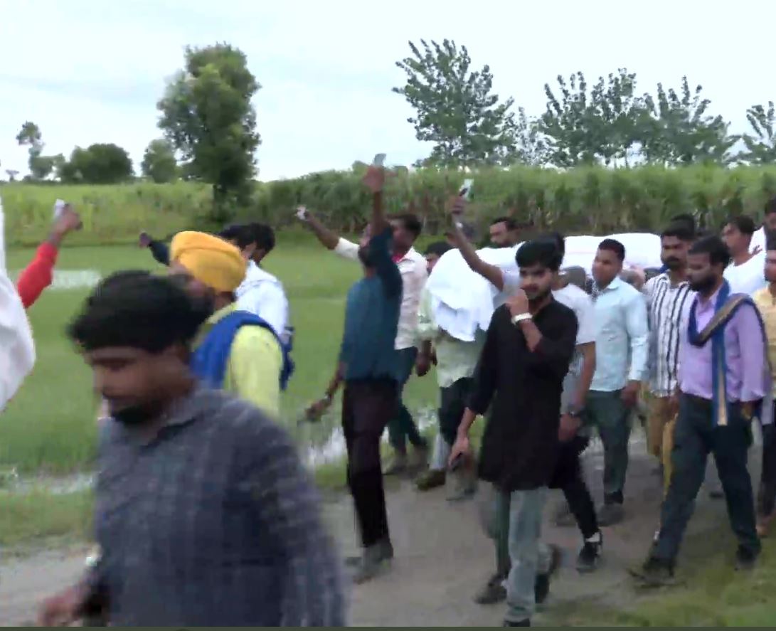 Mortal remains of the victims being taken by their family and others for their last rites. (ANI Photo)