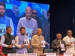 Former president Ram Nath Kovind, union minister Anurag Thakur, former chief justice of India KG Balakrishnan unveil the book titled Former president Ram Nath Kovind, union minister Anurag Thakur, former chief justice of India KG Balakrishnan unveil the book titled