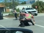 The image, taken from the Facebook video, shows the man tackling the their who tried to steal a car from a mom and her baby.(Facebook/@Okaloosa County Sheriff's Office) The image, taken from the Facebook video, shows the man tackling the their who tried to steal a car from a mom and her baby.(Facebook/@Okaloosa County Sheriff's Office)