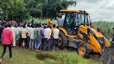 Lakhimpur Kheri, Sept 15 (ANI): Mortal remains of two girls whose bodies were found hanging from a tree being buried, in Lakhimpur Kheri on Thursday. (ANI Photo/ ANI Pic Service) (ANI) Lakhimpur Kheri, Sept 15 (ANI): Mortal remains of two girls whose bodies were found hanging from a tree being buried, in Lakhimpur Kheri on Thursday. (ANI Photo/ ANI Pic Service) (ANI)