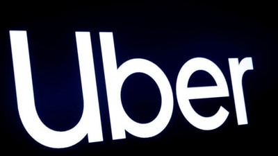 A screen displays the company logo for Uber Technologies Inc at the New York Stock Exchange (NYSE) in New York. (Reuters/Used only for representation) A screen displays the company logo for Uber Technologies Inc at the New York Stock Exchange (NYSE) in New York. (Reuters/Used only for representation)