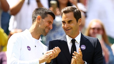 Novak Djokovic with Roger Federer (REUTERS)