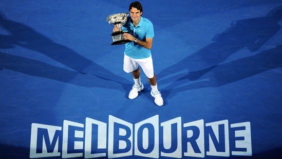 Roger Federer of Switzerland holds the trophy after beating Andy Murray of Britain to win the Men's singles final match at the Australian Open(AP) Roger Federer of Switzerland holds the trophy after beating Andy Murray of Britain to win the Men's singles final match at the Australian Open(AP)