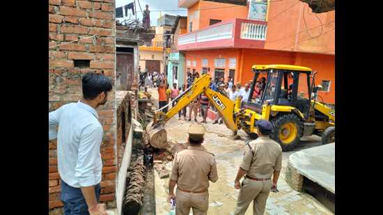 An illegal house being razed in Hamirpur district on Friday. (HT photo)