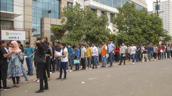 Students wait in a queue to appear in CUET outside a centre in Noida. (PTI) Students wait in a queue to appear in CUET outside a centre in Noida. (PTI)