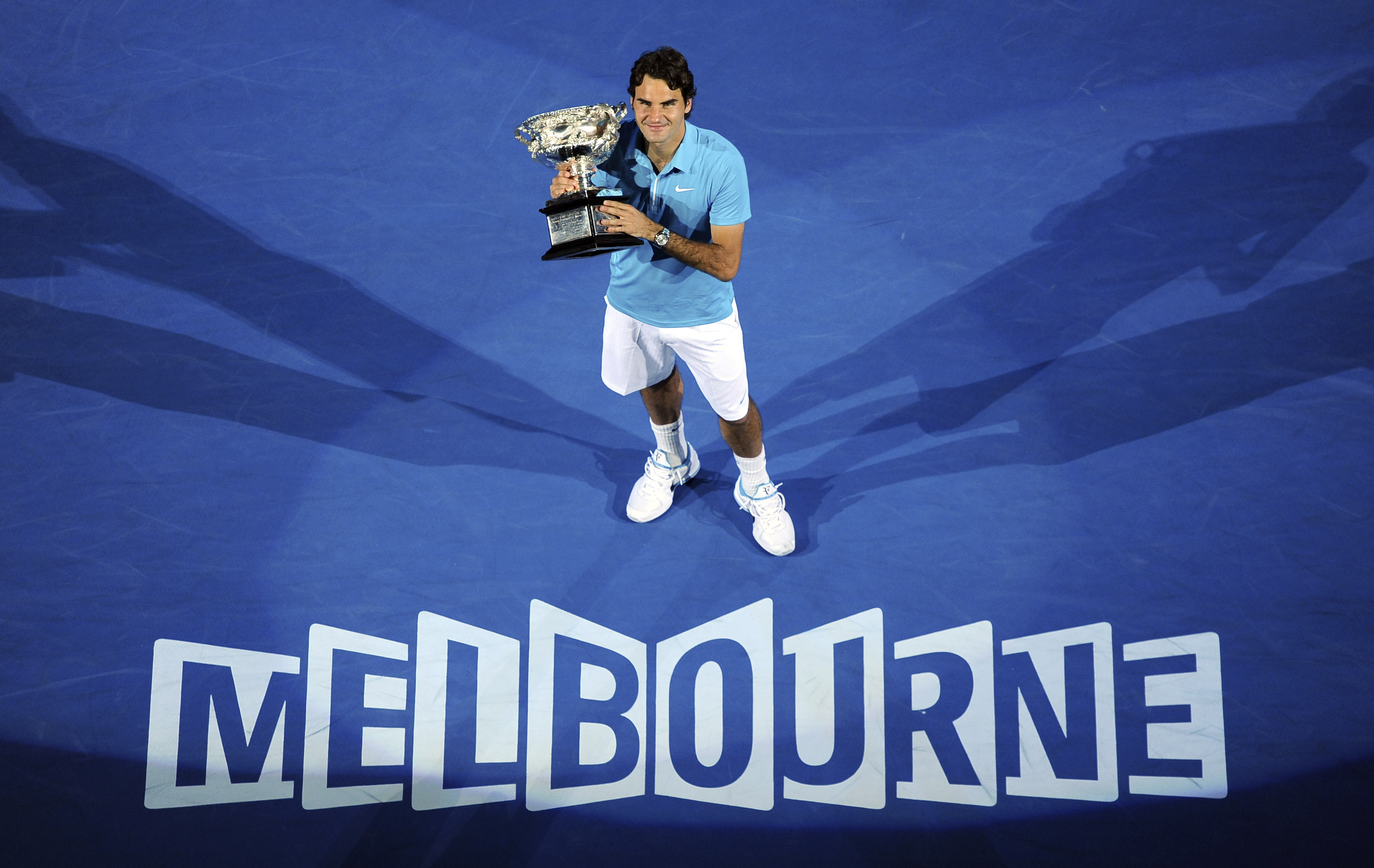 Roger Federer of Switzerland holds the trophy after beating Andy Murray of Britain to win the Men's singles final match at the Australian Open (AP) Roger Federer of Switzerland holds the trophy after beating Andy Murray of Britain to win the Men's singles final match at the Australian Open (AP)