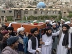 Mourners carry the body of a victim of a mosque bombing in Kabul on August 18. Mourners carry the body of a victim of a mosque bombing in Kabul on August 18. 