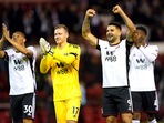 Fulham's Carlos Vinicius, left, goalkeeper Bernd Leno and Aleksandar Mitrovic celebrate after the final whistle of the Premier League soccer match(AP) Fulham's Carlos Vinicius, left, goalkeeper Bernd Leno and Aleksandar Mitrovic celebrate after the final whistle of the Premier League soccer match(AP)