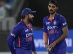 India's Arshdeep Singh, right, listens to captain Rohit Sharma&nbsp;