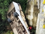 Locals try to rescue passengers after a bus fell from a bridge, in Hazaribagh district, Saturday.(PTI) Locals try to rescue passengers after a bus fell from a bridge, in Hazaribagh district, Saturday.(PTI)