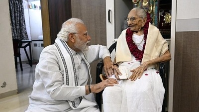 (File photo) Prime Minister Narendra Modi meets his mother Heeraben Modi in Gandhinagar. (PIB) (File photo) Prime Minister Narendra Modi meets his mother Heeraben Modi in Gandhinagar. (PIB)