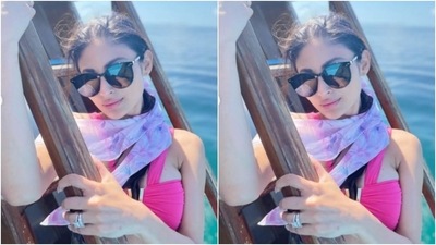 In tinted shades and a white scarf, Mouni further accessorised her look for the day. (Instagram/@imouniroy)