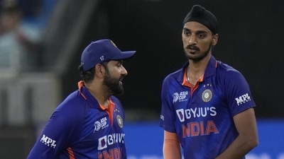 India's Arshdeep Singh, right, listens to captain Rohit Sharma (AP) India's Arshdeep Singh, right, listens to captain Rohit Sharma (AP)