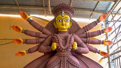 After two years of pandemic-related restrictions, residents of West Bengal gear up to celebrate the biggest festival of the state with full favour and grandeur once again. This year, the 5-day long festival of Durga Puja starts on October 1. Here's how the state is preparing for Durga Puja. (PTI) After two years of pandemic-related restrictions, residents of West Bengal gear up to celebrate the biggest festival of the state with full favour and grandeur once again. This year, the 5-day long festival of Durga Puja starts on October 1. Here's how the state is preparing for Durga Puja. (PTI)