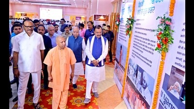 UP CM Yogi Adityanath at the photo exhibition on PM Modi at IGP, Lucknow on Saturday. (HT) UP CM Yogi Adityanath at the photo exhibition on PM Modi at IGP, Lucknow on Saturday. (HT)