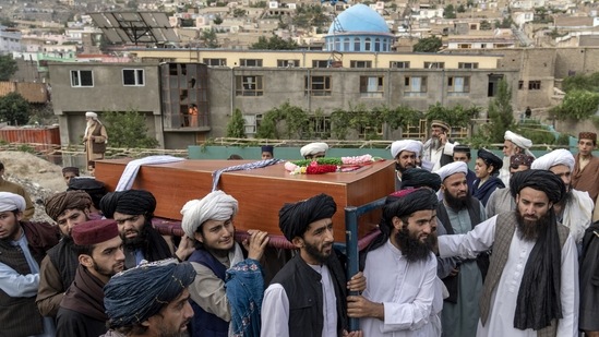 Mourners carry the body of a victim of a mosque bombing in Kabul on August 18.&nbsp;(AP file)