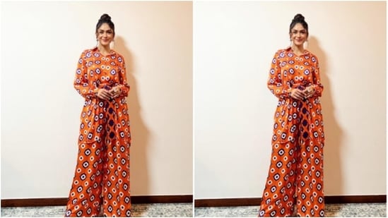 Mrunal played muse to fashion designer house Cuin and picked the comfortable orange jumpsuit from their shelves.(Instagram/@mrunalthakur)