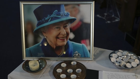 A book of condolence and photo of Queen Elizabeth II are displayed at a church in the district of Southall in London.(AP)