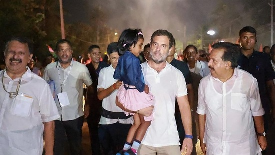 Congress leader Rahul Gandhi with a child during the party's 'Bharat Jodo Yatra', in Alappuzha district.(PTI)