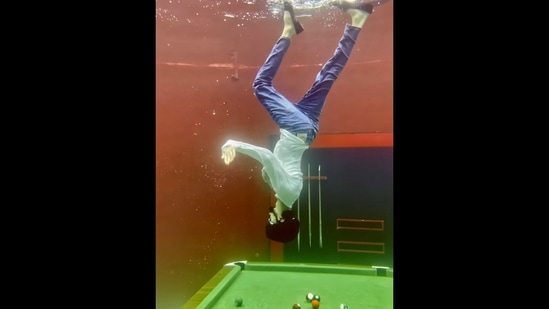 The image, taken from the viral video on Instagram, shows a man doing a Moonwalk upside-down underwater.(Instagram/@hydroman_333)