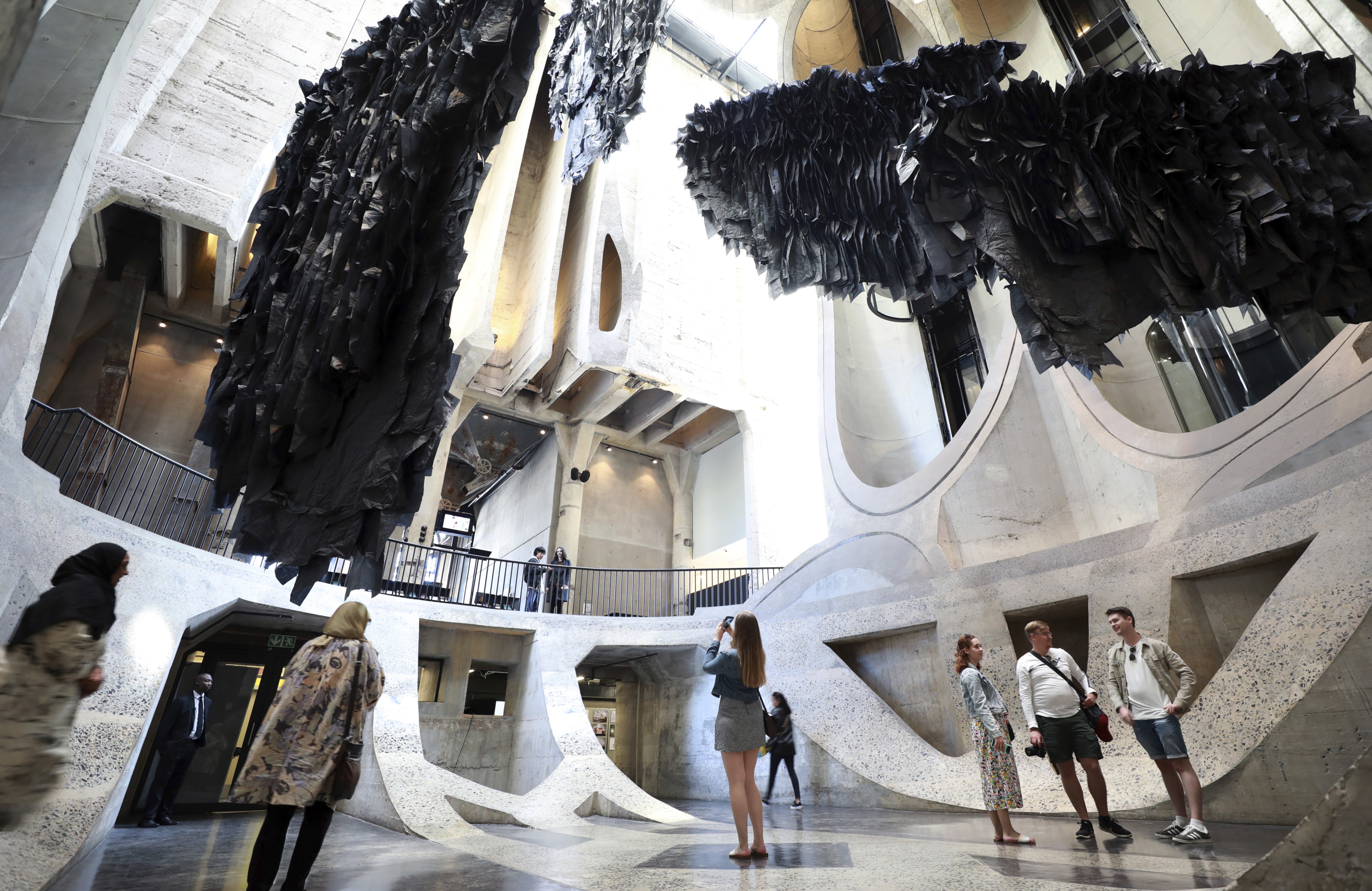 The constructions form a massive, slowly moving mobile that suggests geographical archipelagos and play off the building's massive concrete curving walls.(AP Photo/Nardus Engelbrecht) (AP) The constructions form a massive, slowly moving mobile that suggests geographical archipelagos and play off the building's massive concrete curving walls.(AP Photo/Nardus Engelbrecht) (AP)