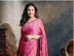 Madhuri Dixit, in a pink chiffon saree, is dressed as a daydream