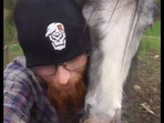 The man cuddles with his horse in this video. (Reddit/@kriskirby86) The man cuddles with his horse in this video. (Reddit/@kriskirby86)