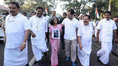 Congress leader Rahul Gandhi walks with a young supporter during the party's 'Bharat Jodo Yatra', in Alappuzha district. (PTI) Congress leader Rahul Gandhi walks with a young supporter during the party's 'Bharat Jodo Yatra', in Alappuzha district. (PTI)