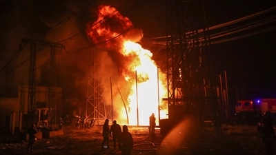 Firefighters work at a site of a thermal power plant damaged by a Russian missile strike, amid Russia's attack on Ukraine, in Kharkiv. (REUTERS)