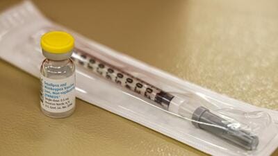 A vial containing the monkeypox vaccine and a syringe is set on the table at a vaccination clinic run by the Mecklenburg County Public Health Department in Charlotte, North Carolina. (AP)