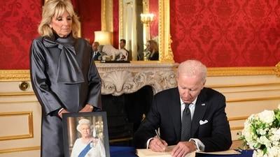 US President Joe Biden (R), accompanied by the First Lady Jill Biden (L), sign a book of condolence at Lancaster House in London on Sunday following the death of Queen Elizabeth II. (AFP) US President Joe Biden (R), accompanied by the First Lady Jill Biden (L), sign a book of condolence at Lancaster House in London on Sunday following the death of Queen Elizabeth II. (AFP)