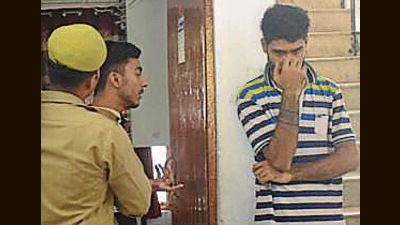 Two students arrested for violating traffic rules as they were caught cutting a cake on the elevated road, in Ghaziabad , on Sunday. (Sakib Ali/HT Photo) Two students arrested for violating traffic rules as they were caught cutting a cake on the elevated road, in Ghaziabad , on Sunday. (Sakib Ali/HT Photo)