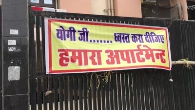 "Yogi ji please demolish our apartment"- read the poster pasted by the residents of the KDA Residency, a gated community in Kanpur. (ANI) "Yogi ji please demolish our apartment"- read the poster pasted by the residents of the KDA Residency, a gated community in Kanpur. (ANI)