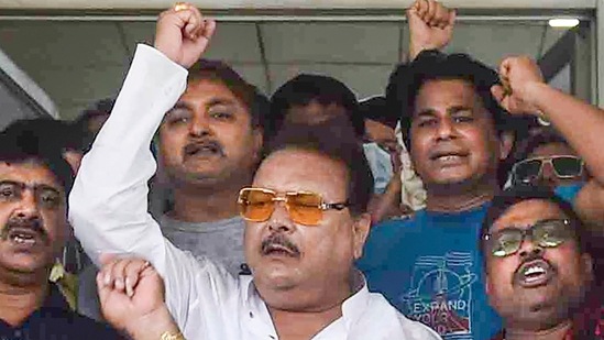 Trinamool Congress MLA Madan Mitra with supporters during a protest.