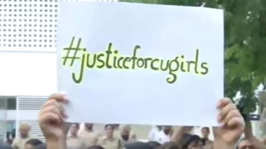 Protesters were seen holding placards with ‘Justice for CU girls’ written on it(ANI)