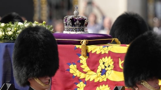 Queen Elizabeth II's Funeral: Grenadier Guards flank the coffin of Queen Elizabeth II during a procession.(AP)