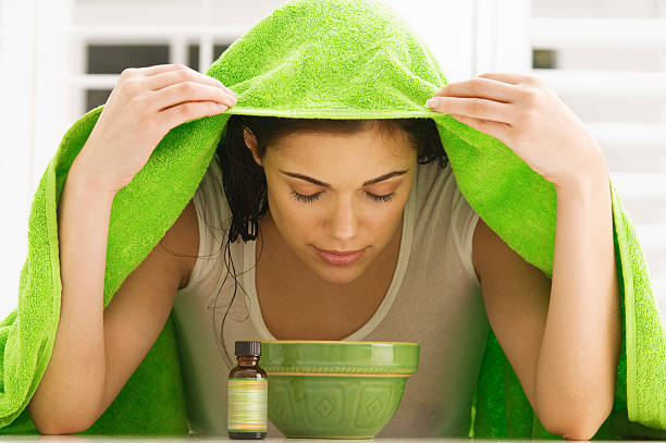 Steaming helps in sinus infection because as a person breathes it in, it moistens their sinus passages.