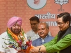 Former Punjab CM Amarinder Singh being welcomed by Union Ministers Kiren Rijiju and Narendra Singh Tomar as he joins Bharatiya Janata Party in New Delhi.
