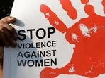 A person holding a banner to oppose acts of rape and violence against women. (AFP/Representative image) A person holding a banner to oppose acts of rape and violence against women. (AFP/Representative image)